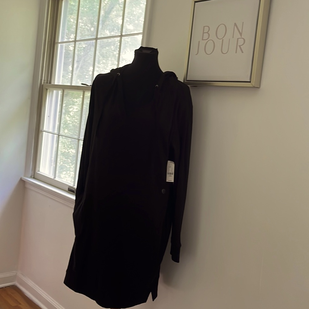 New York & Co Black pull over dress with pockets & a hood has soon stretch